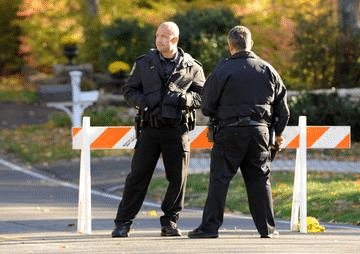Police responding to an unattended dead body at a house